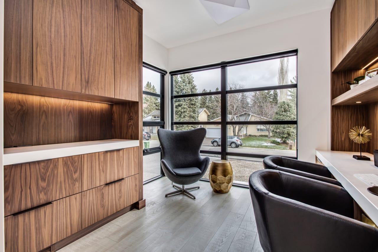 Contemporary home office with walnut cabinetry and under-cabinet lighting. 